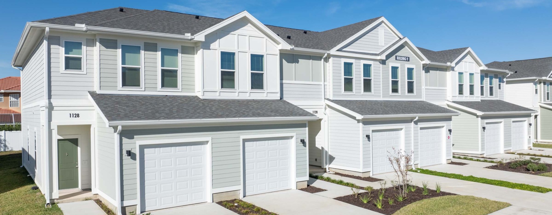 a white house with garages