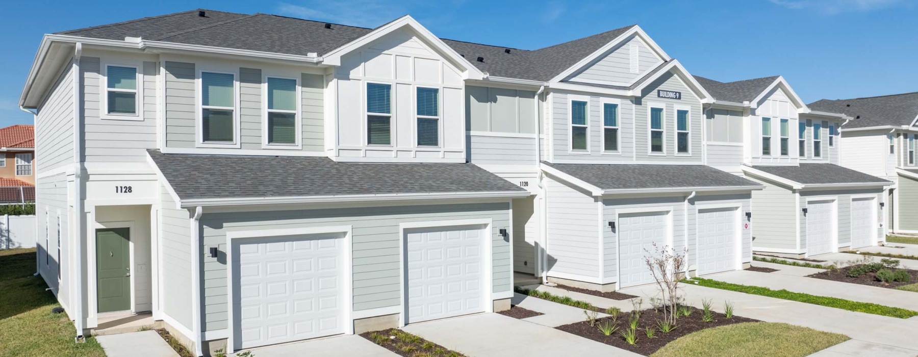 a white house with garages