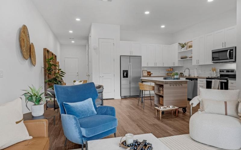 a living room with white furniture