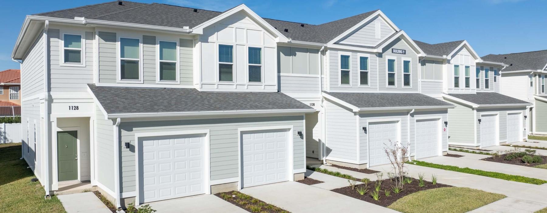a white house with garages